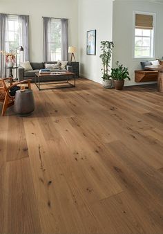 a living room filled with furniture and wooden floors