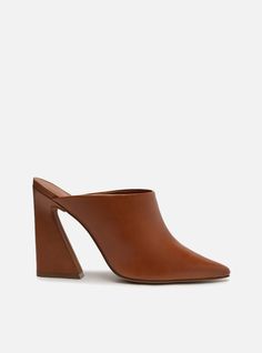 Brown leather mule. The style features a block heel with a flared base and a pointed toe. It has a closed upper that covers the entire top of the foot. Open at the back, it shows the heel. With an insole matching the color of the mule. Why follow this trend? Whether you are dressing up for a night or adding some glamou Brown Kitten, Block Heel Mule, Block Heel Mules, High Heel Mules, Heel Mules, Leather Mules, Brown Shoe, Chic Dress, Leather Slip Ons