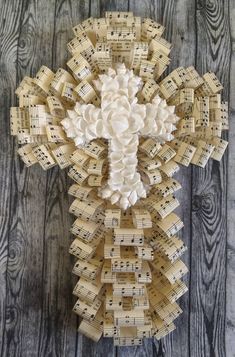 a cross made out of old sheet music