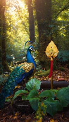 a blue and gold peacock standing next to a candle holder in the middle of a forest