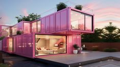 a pink container home is sitting on a deck