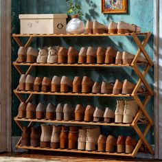 there are many pairs of shoes on the shelf