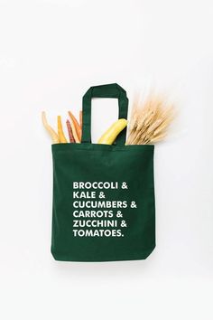 Start tab labels Calling all veggie lovers! Broccoli, kale, cucumbers, take your pick on this tote. Say no to plastic! Take our reusable tote bags to the farmer's market, grocery store, library, beach, you name it. Choose from a variety of sizes and color options. Veggie List, Say No To Plastic, Zucchini Tomato, Shipping Envelopes, Gardening Apron, Biodegradable Packaging, Fall Kids, Farmer's Market, Adulting Shirts