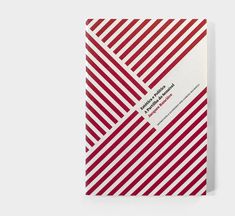 a red and white striped notebook with a label on it