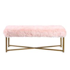 a pink bench with gold legs and a long fur cover on the top, against a white background