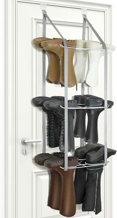 an over the door shoe rack with four pairs of boots hanging from it's sides