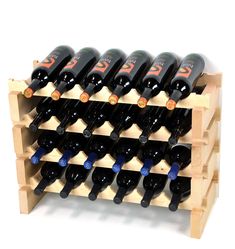 a wooden wine rack filled with lots of black bottles on top of eachother