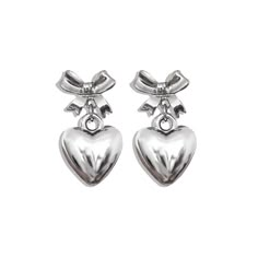 Visit our website at www.ShopGeminiJewels.com for better prices and latest products. HEARTS & BOWS COLLECTION ⋆౨ৎ˚⟡.* Cute little bow earrings with a heart drop. Measurements - Earring size: 3.2 x 2.8 cm Materials - Silver plated brass Nickel & lead free Delicately handmade Gemini Jewels, Sliver Earrings, Trendy Rings, Pearl Necklaces, Trendy Ring, Silver Bow, Puffy Heart, Jewelry Lookbook, Custom Name Necklace