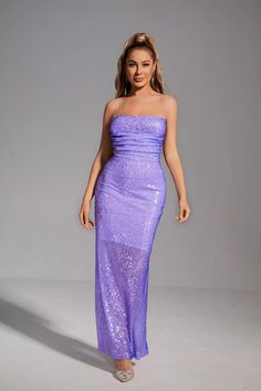 The glittering Gabriela Purple Sequin Maxi Dress will definitely make you the focus! With a fine workmanship sequined fabric, this maxi dress is well wrapped in the whole body, showing a charming figure. Halter neck and backless design add sexy charm. Whether it is a banquet or an important party, this item will be the best choice in your wardrobe!  Dress Length: Approx 131cm Materials: Sequin Gentle Dry Clean Only  The model is 5 ft 7 and wears size S  Color may vary due to lighting on images. Glittery Purple Dress, Sequin Gown For Party, Glamorous Sequin Maxi Dress For Prom, Sequined Maxi Gown For Party, Glamorous Sequined Maxi Dress For Prom Season, Sequin Maxi Length Gown For Party, Contrast Sequin Maxi Dress For Party Season, Glamorous Sequin Maxi Evening Dress, Sparkling Backless Sequin Dress For Prom