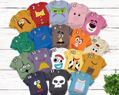 the children's t - shirts are all different colors and have faces on them