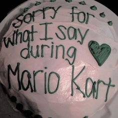 a cake with writing on it that says sorry for what i say during mario kart