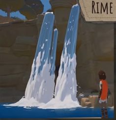 a boy standing in front of a fake iceberg with the words rime on it