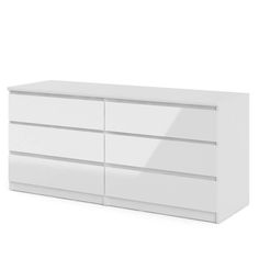 a white dresser sitting on top of a white floor