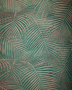 a green and beige wallpaper with palm leaves on the bottom half, in an intricate pattern