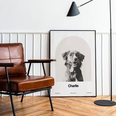 a chair sitting next to a poster with a dog on it