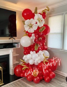 balloons and flowers are arranged in the shape of a christmas tree for an easy party