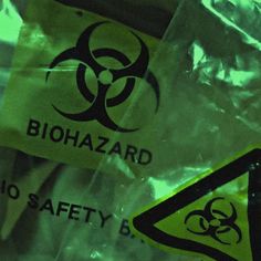 biohazard signs on plastic bags in the dark