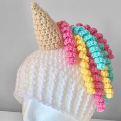 a crocheted hat with an ice cream cone on it's brim