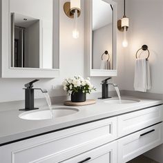 a white bathroom with two sinks and three mirrors on the wall next to each other