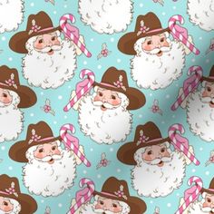 a pink christmas wrapping paper with santa claus and candy canes printed on it's face