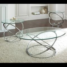 two glass tables sitting on top of a white rug