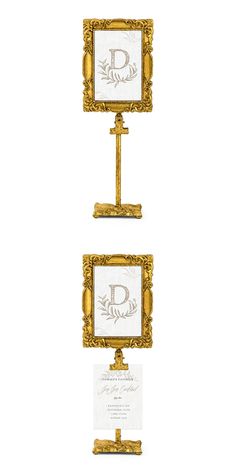 two gold frames with the letter d on them