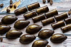 some brown rocks and nuts on a wooden table