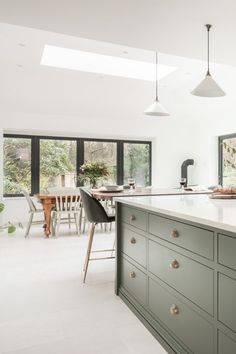 the kitchen is clean and ready to be used for cooking or dining room furniture, as well as an island countertop