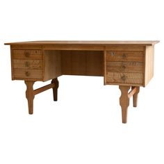 a wooden desk with two drawers on one side and an open drawer on the other