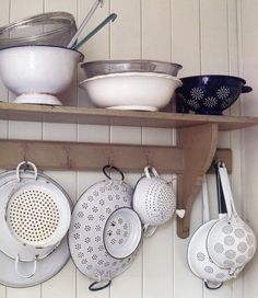 pots and pans are hanging on the wall