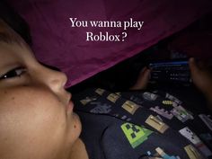 a young boy laying in bed with the text you wannan play roblox?