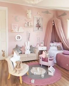 a child's bedroom decorated in pink and white