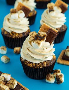 chocolate cupcakes with white frosting and sprinkled marshmallows