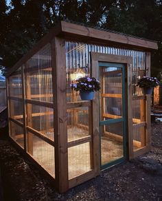 a small wooden structure with plants growing out of it