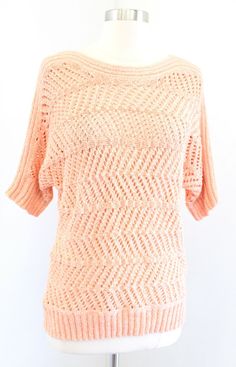 NWT Chicos Peach Orange Open Knit Crochet Pullover Sweater Top Size 1 NWT Chicos Peach Orange Open Knit Crochet Pullover Sweater Top Size 1 Size 1 Pit to pit: 19", dolman style underarm Top of shoulder to bottom hem: 25" New with tags, unworn. **The inner chico's tag has come unsewn on one side as shown. (ID:E5) Pointelle Knit Sweater For Spring, One Size Open Knit Sweater, One Size Pointelle Knit Sweater For Fall, Cozy Knit One Size Tops, One Size Soft Knit Sweater For Spring, Cozy Knit Crochet Top For Fall, Pink Casual Crochet Top, Crew Neck Crochet Top For Layering, Casual Pink Crochet Top For Winter