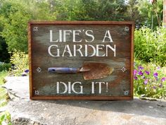 a garden sign that says, life's a garden dig it