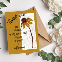 a thank you card with a yellow flower on it next to white flowers and greenery