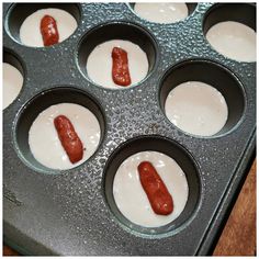 hotdogs in a muffin tin ready to be baked