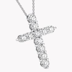 A precious interpretation of a classic motif, our medium cross pendant in white gold is available in a variety of different carat weights, seen here with 0.15 carat diamonds. Deftly suspended from a white gold chain, each diamond is embraced by a minimal metal setting, optimising their brilliance and presence. The Classic Graff collection celebrates the purity and fire of the finest Graff diamonds showcased in truly timeless jewels and eternally elegant silhouettes. A precious interpretation of Graff Necklace, Graff Jewelry, Graff Diamonds, White Gold Chain, Types Of Diamonds, White Gold Chains, Custom Pendants, Round Diamond Engagement Rings, Diamond Cross