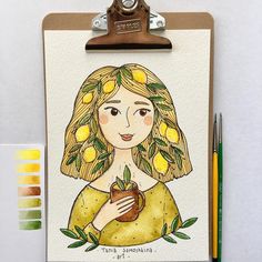 a clipboard with a drawing of a woman holding a cup and lemons on it