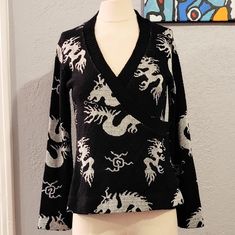 Stunning 1970s Giorgio Sant Angelo Knit Wrap Sweater With One Of My Favorite Chinese Motifs, The Dragon Chasing The Flaming Pearl. It's A Wool Knit In Black And Pale Silver With A Subtle Sheen That's Hard To Capture In Photos. The Style Is Classic And Flattering With Interior Tie, Side Snap Closure And A Slight Bell Sleeves. Size Medium, Measurements To Come. In Excellent Condition. Dragon Sweater, Knit Wrap Sweater, Chinese Motifs, Side Snap, Knit Wrap, Wool Knit, Wrap Sweater, The Dragon, Vintage 70s