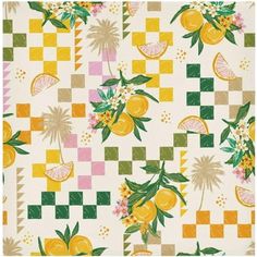 an oranges and lemons pattern is shown on a checkered tablecloth with green leaves