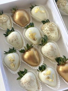 chocolate covered strawberries with gold sprinkles in a white box