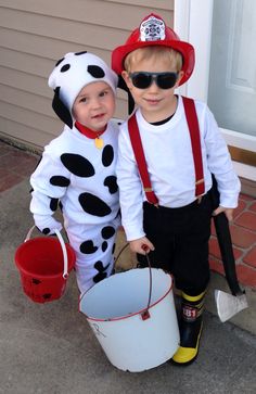 two young boys dressed up in costumes for halloween