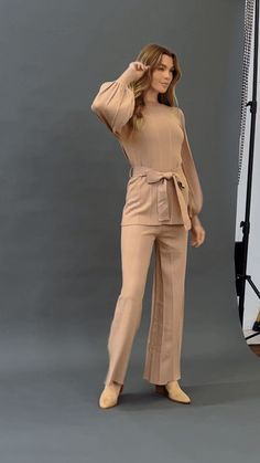 This contemporary sweater pant set offers the perfect blend of style and comfort. Featuring a round neckline, puff sleeve cuff, and a self sash tie, this set is a must-have for any wardrobe. The matching pants have a wide leg cut and an elasticized waistband for a perfect fit. Enjoy the stylish look of this sweater pant set and keep smiling even when you're feeling down! Details Self: 80% Rayon, 20% Nylon Lining: 100% Polyester Size & Fit - Model is 5`8" And Wearing Size Small - Measurements Tak When Youre Feeling Down, Top And Pants Set, Keep Smiling, Matching Pants, Sleeve Cuff, Feeling Down, Vintage Inspired Design, Sweater Pants, Pant Set