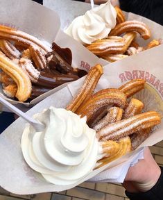 three baskets filled with different types of desserts on top of paper wrappers next to each other