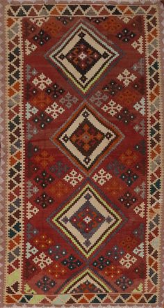 an old rug with many different colors and patterns