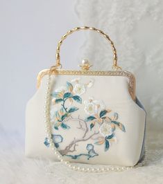 Size and scale 24cm (L) x 16cm (H) x 7cm (W) ✿ Bags are made of velvet and fully lined with pearl metal button buckle. ✿ A metal handle drop,  a pearl drop and shoulder strap. ✿ Elegant embroidered flowers--Plum Blossoms and Peony. ✿ Pure Handmade, exquisite workmanship, a pretty wedding/party/daily accessory for ladies and girls. ✿ Great gift idea for girls, friends, family, teachers, nurses, birthdays, and many more occasions. Please see more Clutches & Evening Bags: https://www.etsy.com/shop/ Spring Purses, Sac Diy, Hand Bags For Women, Girly Bags, Elegant Bags, Fancy Bags, Pretty Bags, Cute Bags, Womens Purses