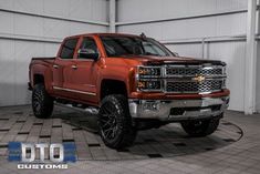 a red truck is parked in a garage