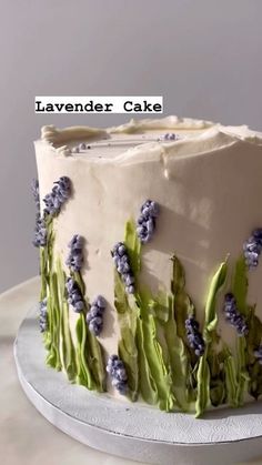 a white cake with blue flowers on it